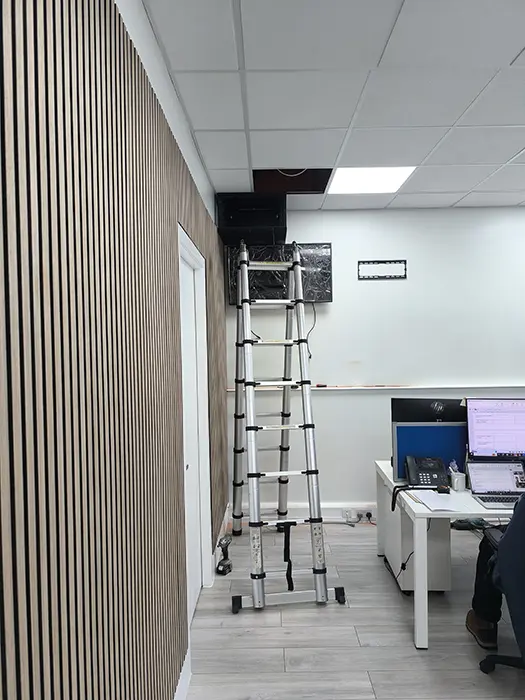 Installation of a wall-mounted network server rack in a modern London office by CCTVcam